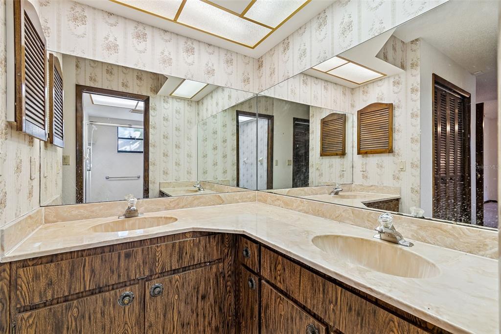 2051 Laredo Avenue Spring Hill, FL 34608 - Photo 44 of 76 a bathroom with a sink and a mirror