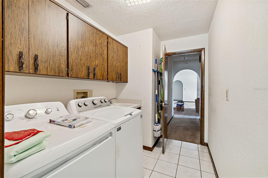2051 Laredo Avenue Spring Hill, FL 34608 - Photo 47 of 76 a room with a washing machine with the view of living room