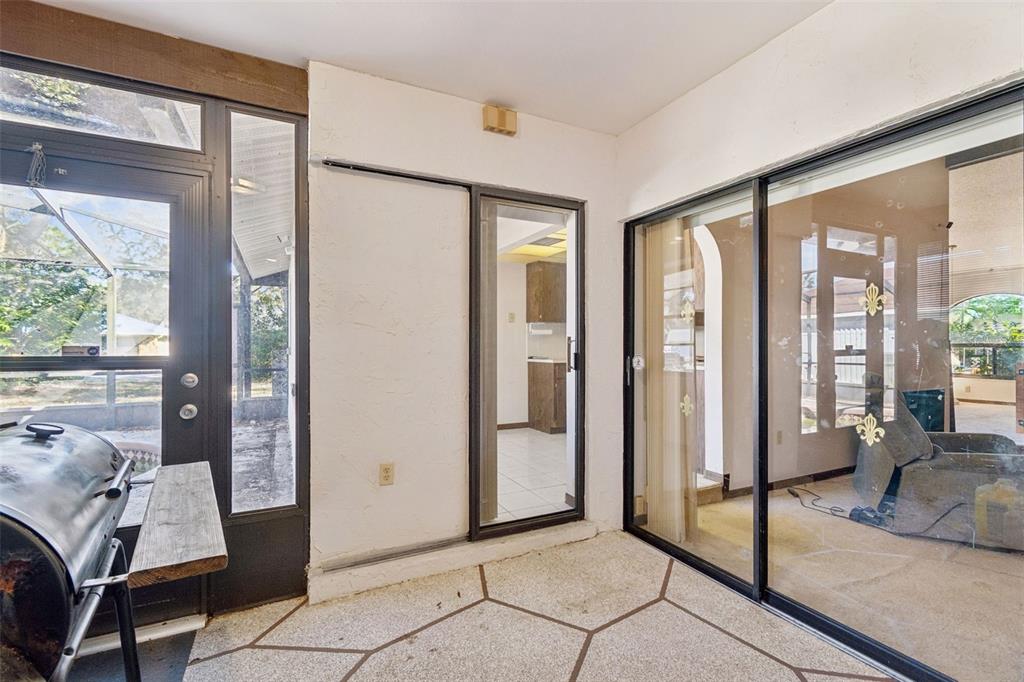 2051 Laredo Avenue Spring Hill, FL 34608 - Photo 51 of 76 a view of a livingroom with furniture and floor to ceiling window