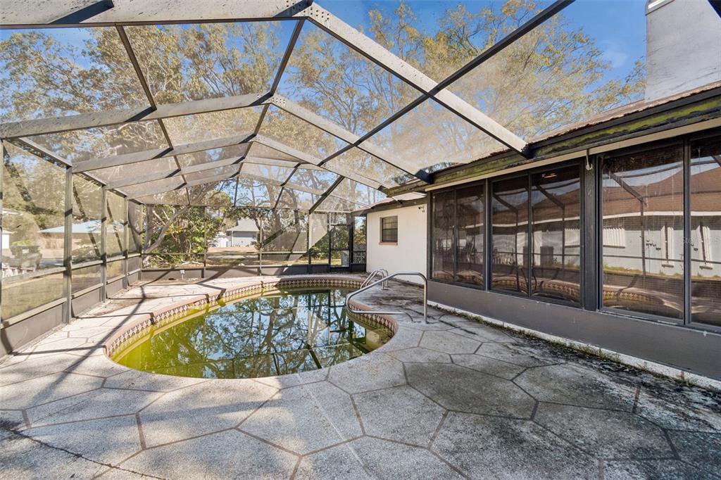 2051 Laredo Avenue Spring Hill, FL 34608 - Photo 54 of 76 a view of a swimming pool with a patio