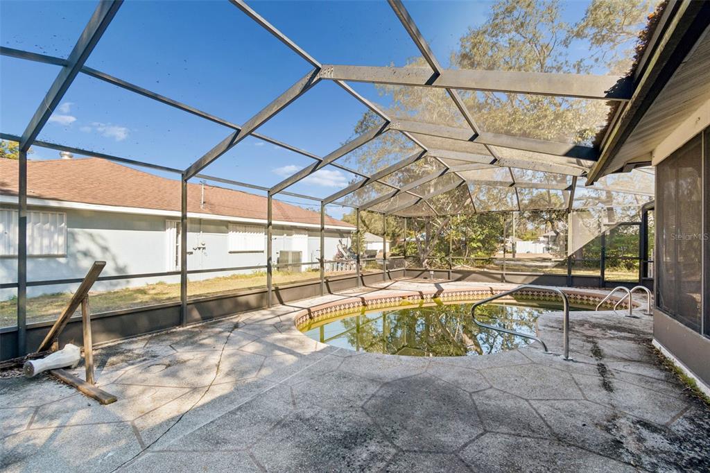 2051 Laredo Avenue Spring Hill, FL 34608 - Photo 55 of 76 a view of a swimming pool with a patio