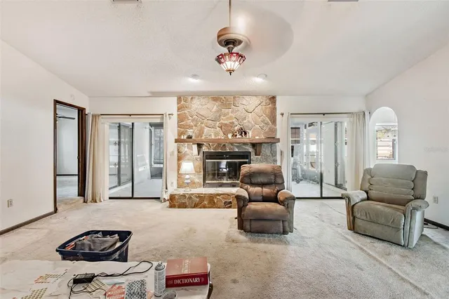 a kitchen with a sink a stove and cabinets