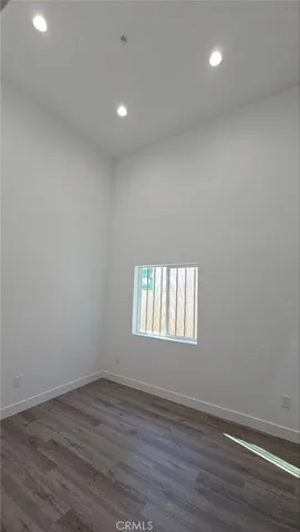 a bathroom with a sink shower and a mirror