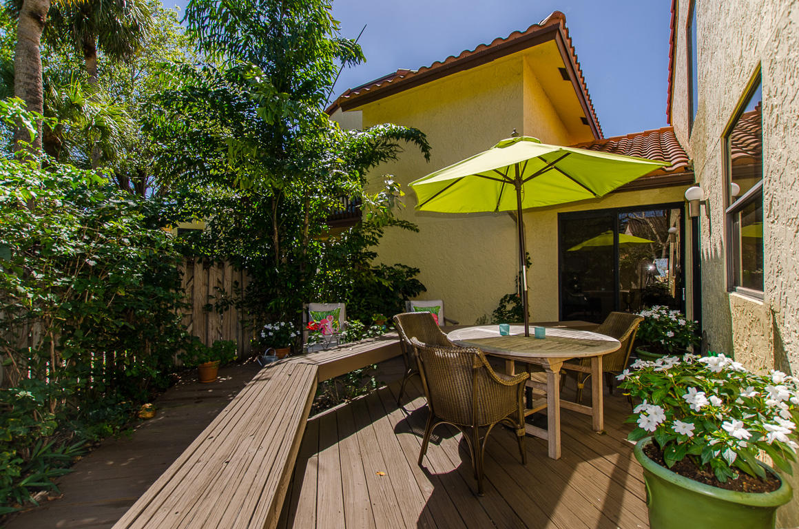 5789 Fox Hollow Drive, Unit C Boca Raton, FL 33486 - Photo 21 of 47 35- Outside Dining and bench seating