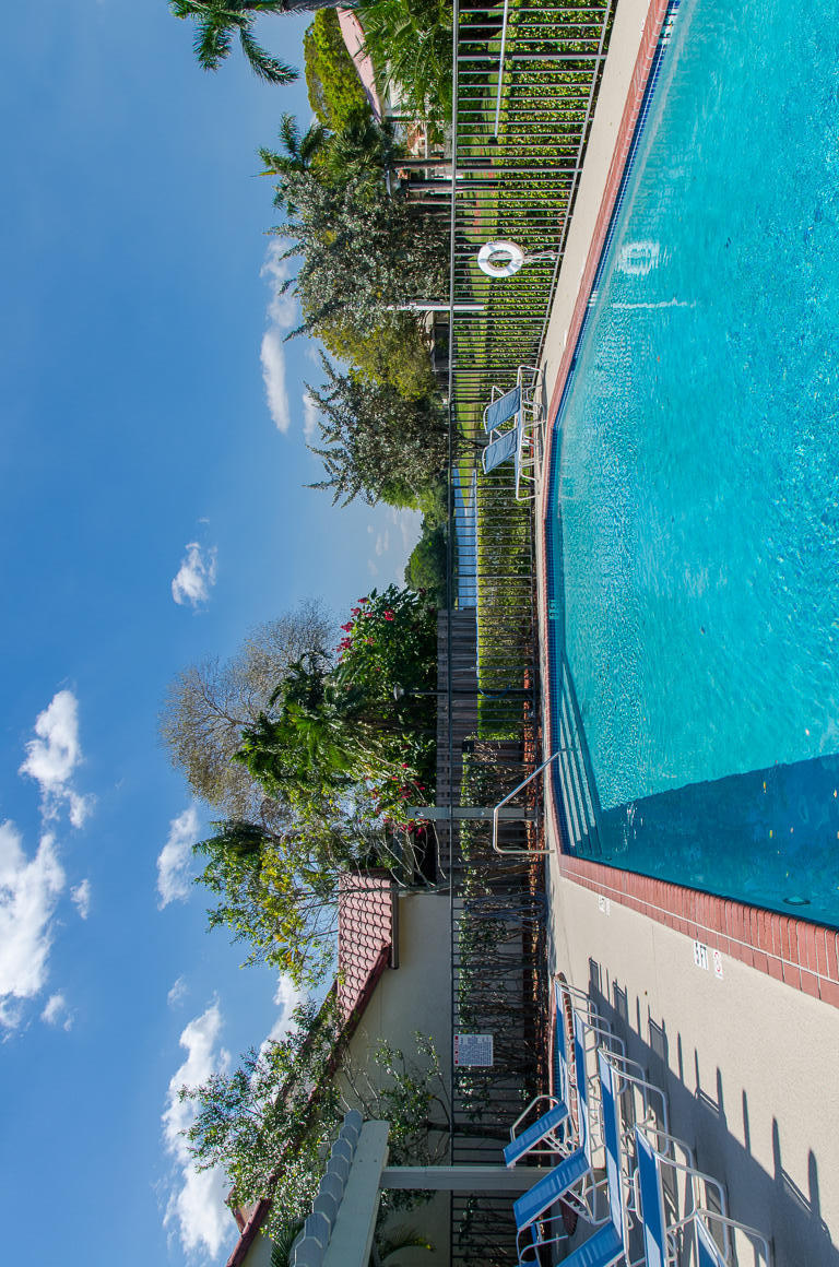 5789 Fox Hollow Drive, Unit C Boca Raton, FL 33486 - Photo 46 of 47 9. Community Pool with lakeviews