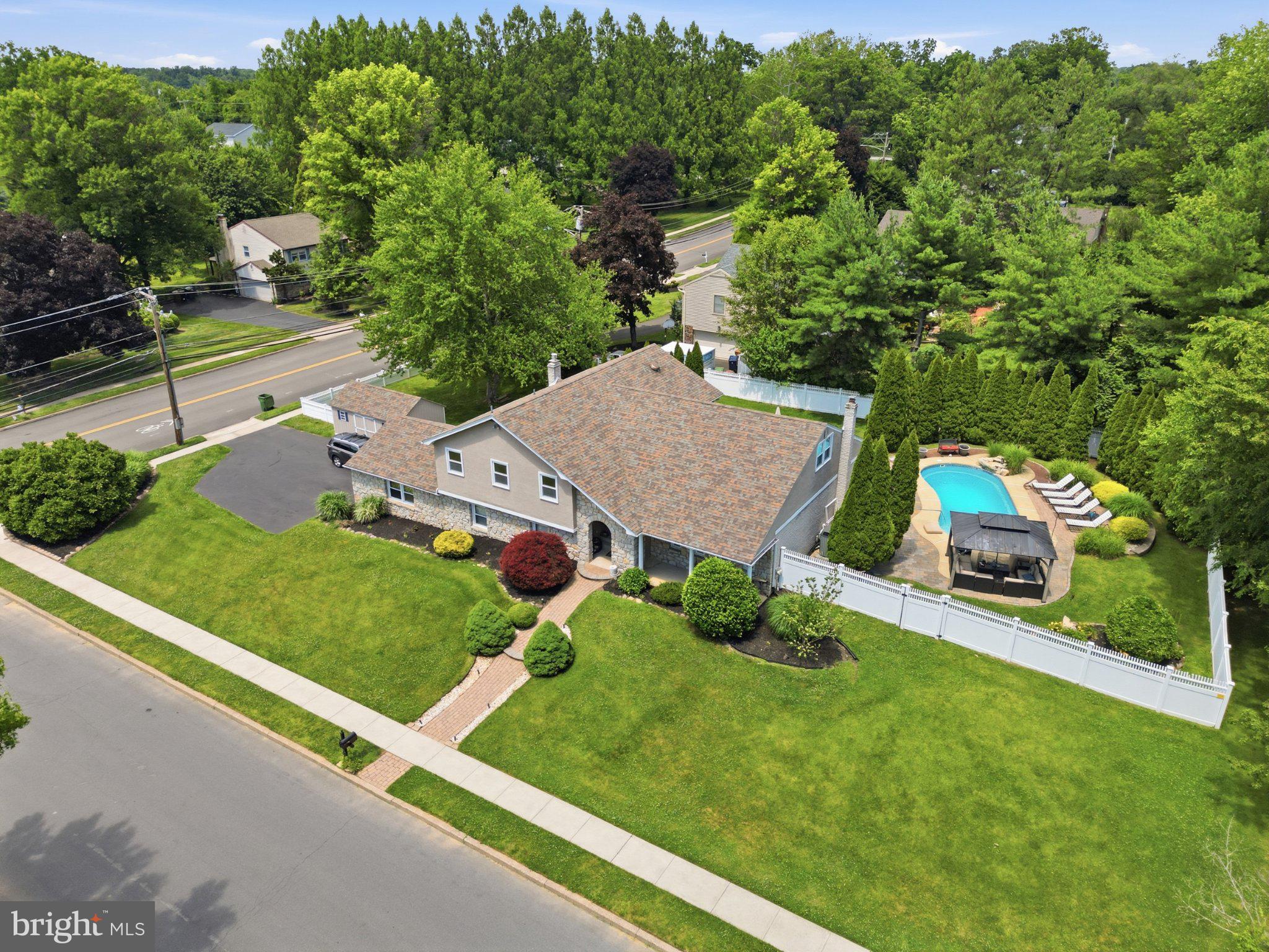 1002 Tannerie Run Road Ambler, PA 19002 - Photo 12 of 67 Charming home with lush greenery and pool.