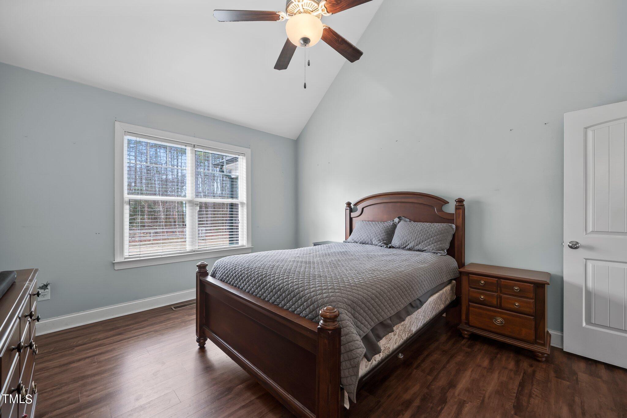 3195 Johnston County Road Angier, NC 27501 - Photo 17 of 31 a bedroom with a bed and wooden floor