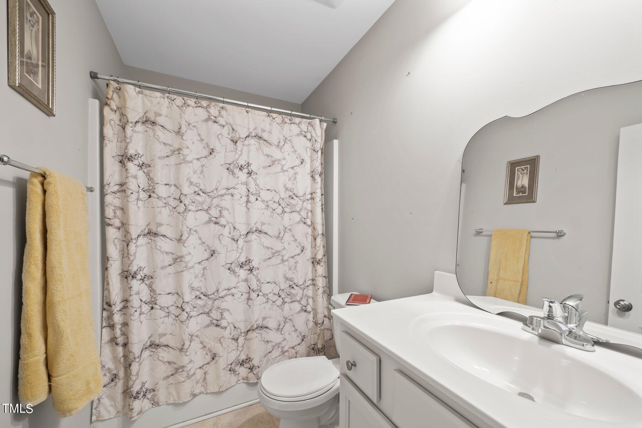 3195 Johnston County Road Angier, NC 27501 - Photo 23 of 31 a bathroom with a sink toilet and shower