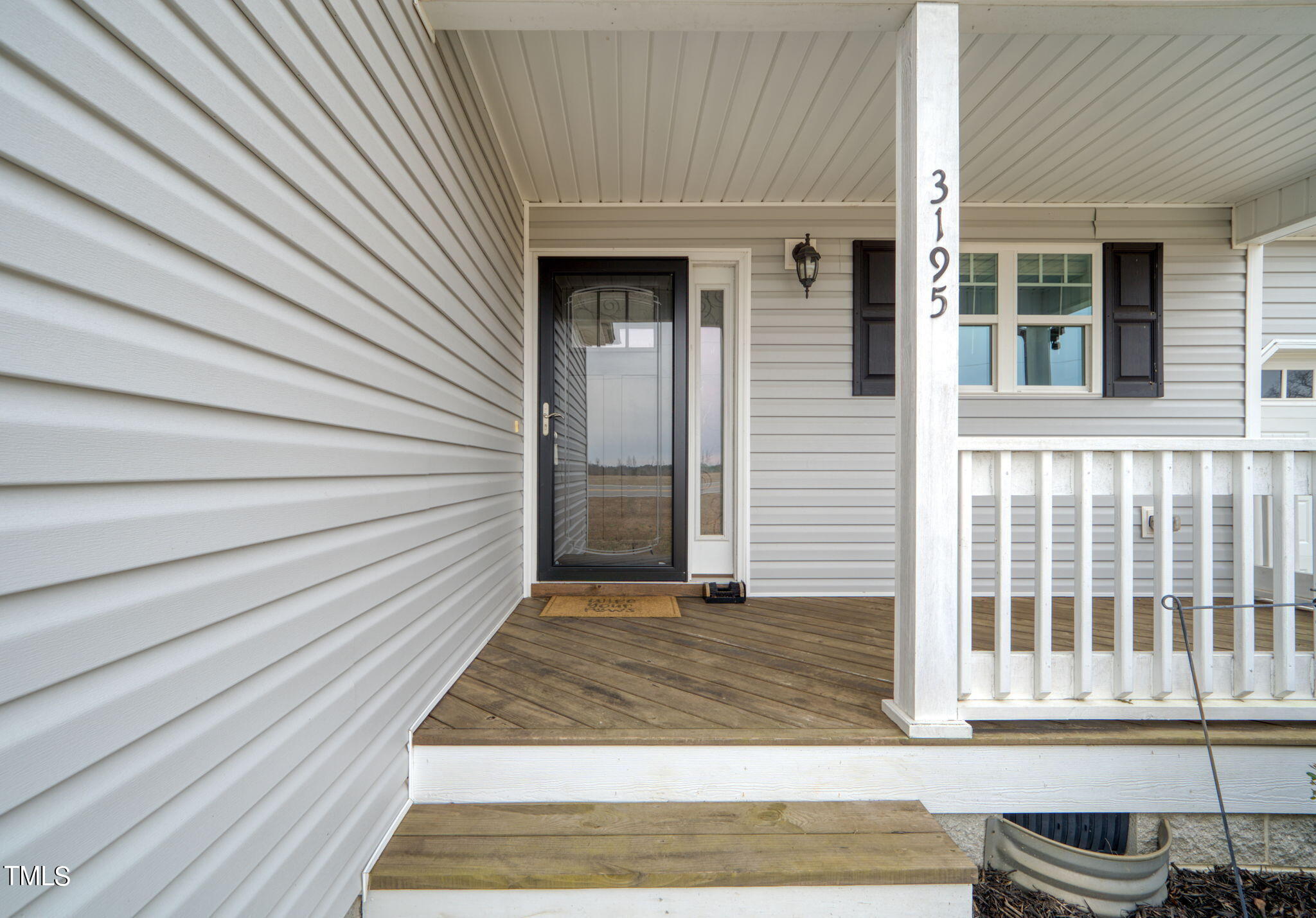 3195 Johnston County Road Angier, NC 27501 - Photo 4 of 31 a view of a house with a door and wooden floor