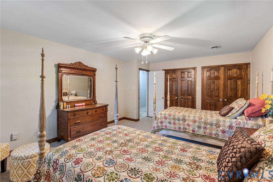 5700 Elfinwood Road Chester, VA 23831 - Photo 21 of 38 a bedroom with a bed dresser and a window