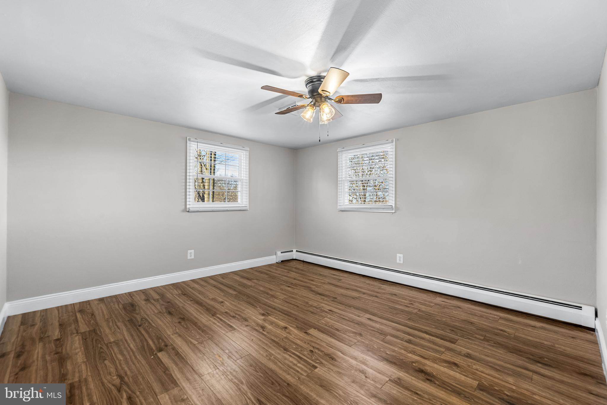 209 Forest Hills Road Red Lion, PA 17356 - Photo 18 of 43 wooden floor in an empty room with a window