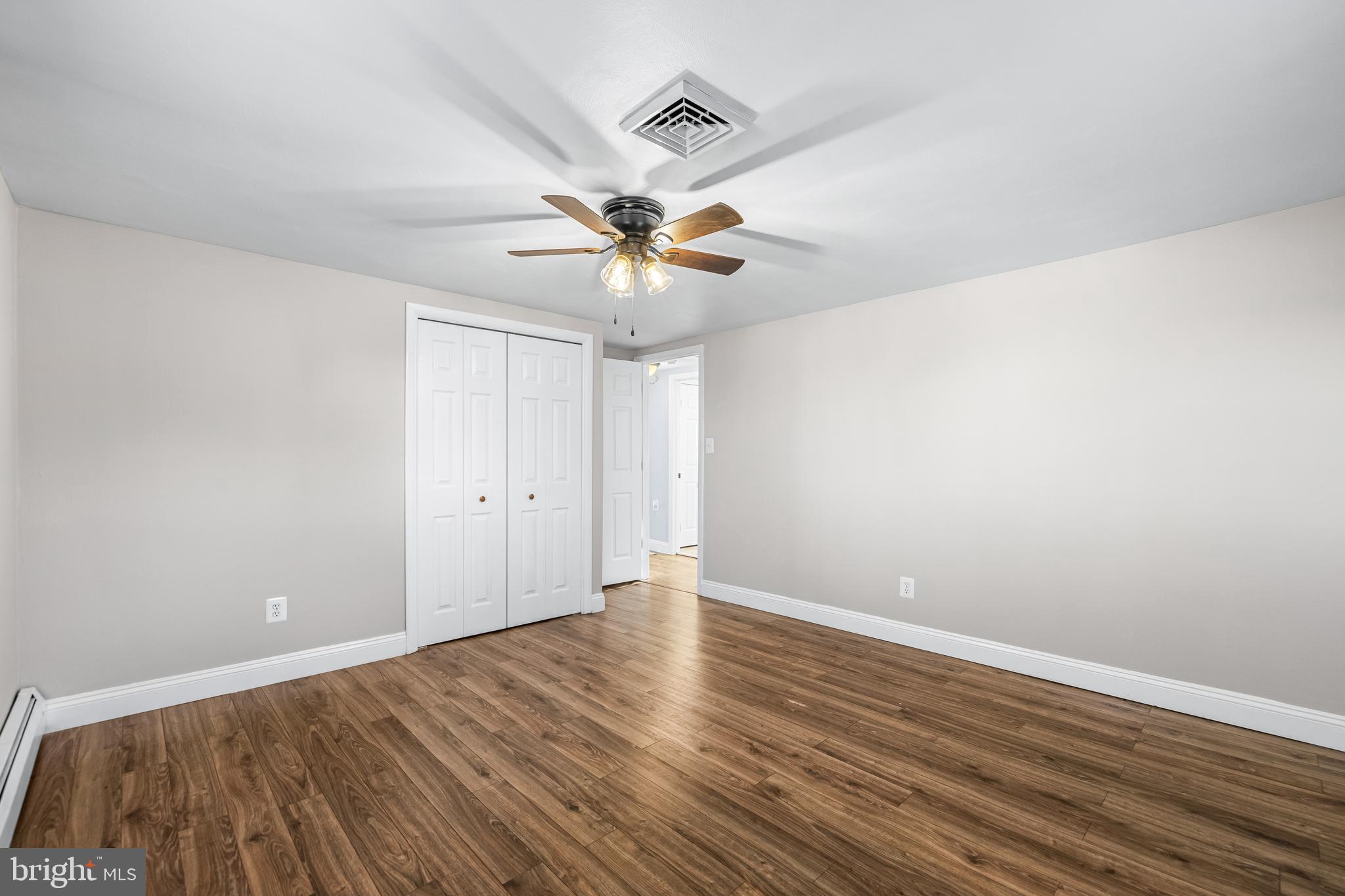 209 Forest Hills Road Red Lion, PA 17356 - Photo 19 of 43 wooden floor in an empty room with a window