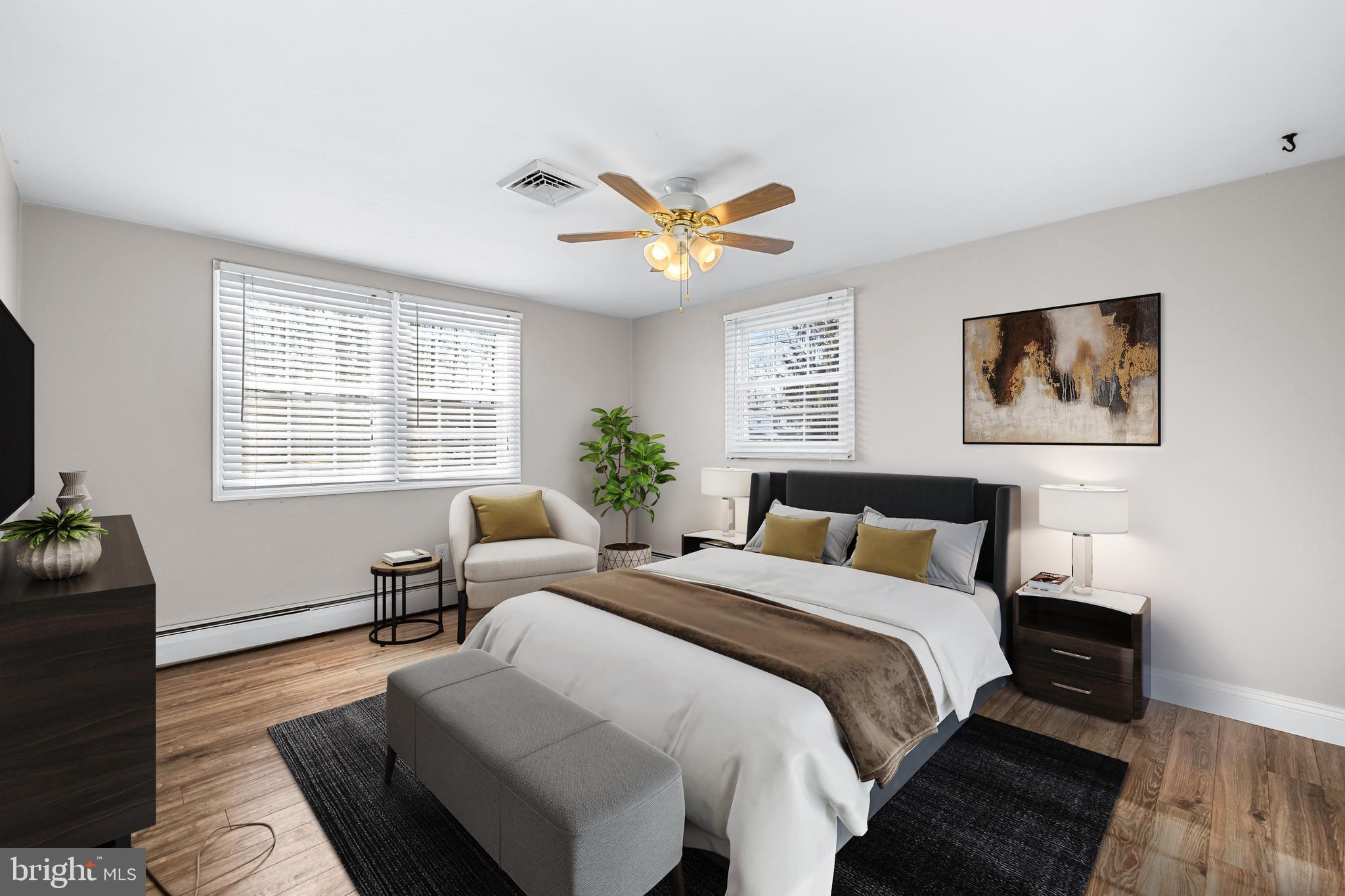 209 Forest Hills Road Red Lion, PA 17356 - Photo 20 of 43 a spacious bedroom with a bed and a couch