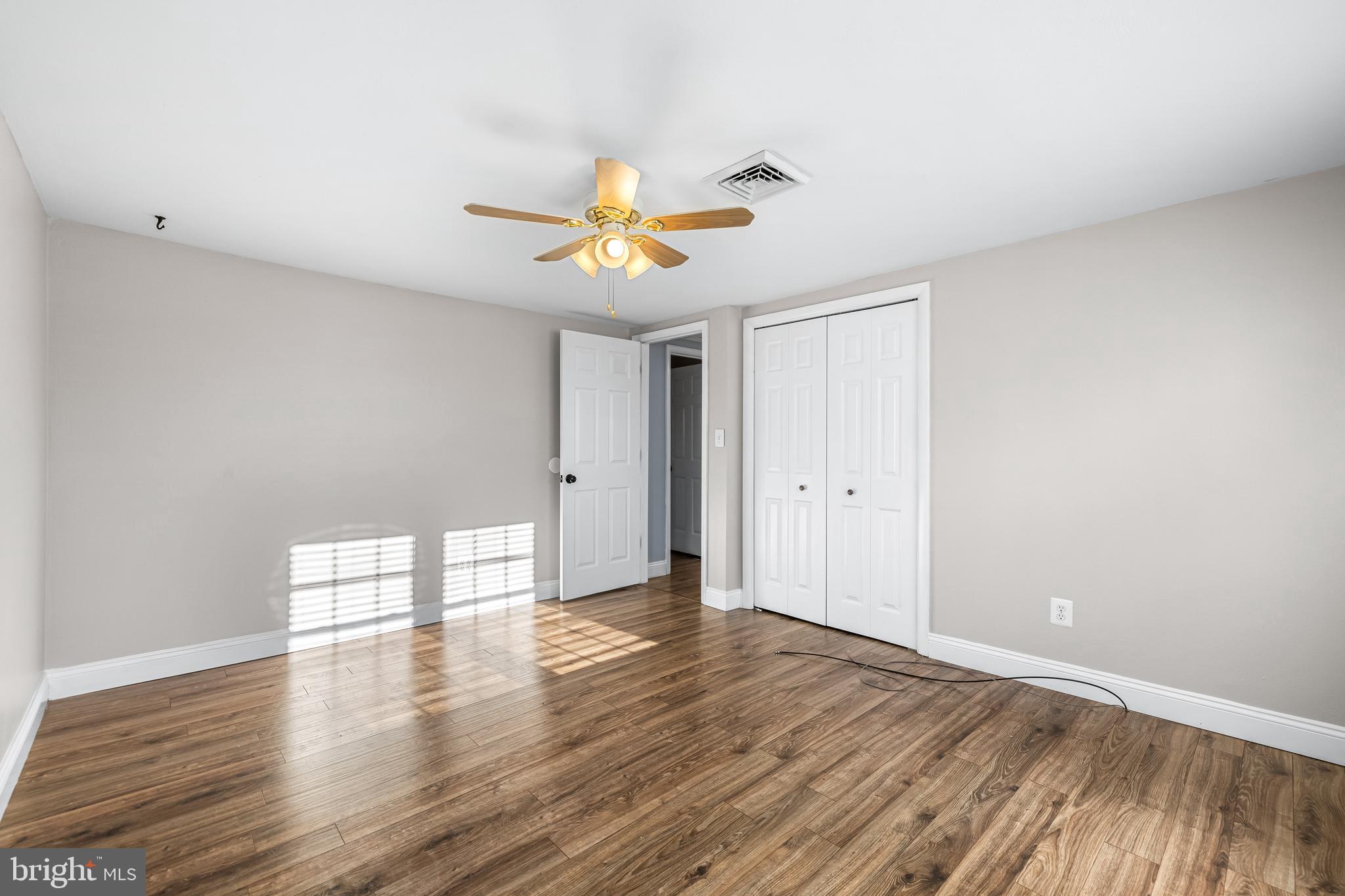 209 Forest Hills Road Red Lion, PA 17356 - Photo 22 of 43 a view of empty room with wooden floor and fan