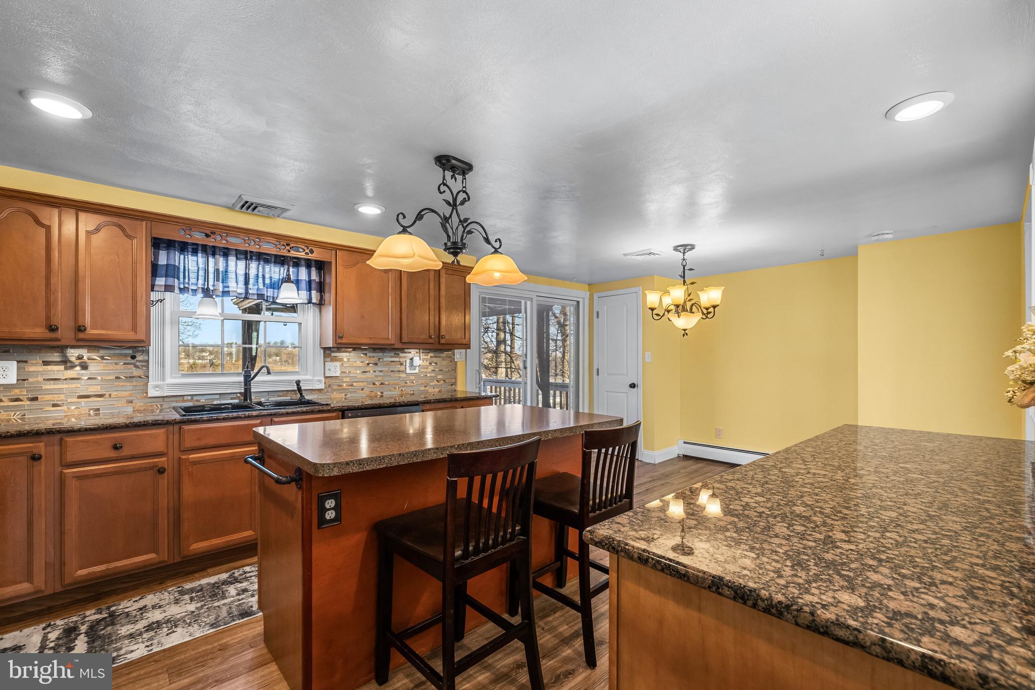 209 Forest Hills Road Red Lion, PA 17356 - Photo 8 of 43 a kitchen with stainless steel appliances granite countertop wooden cabinets and counter space