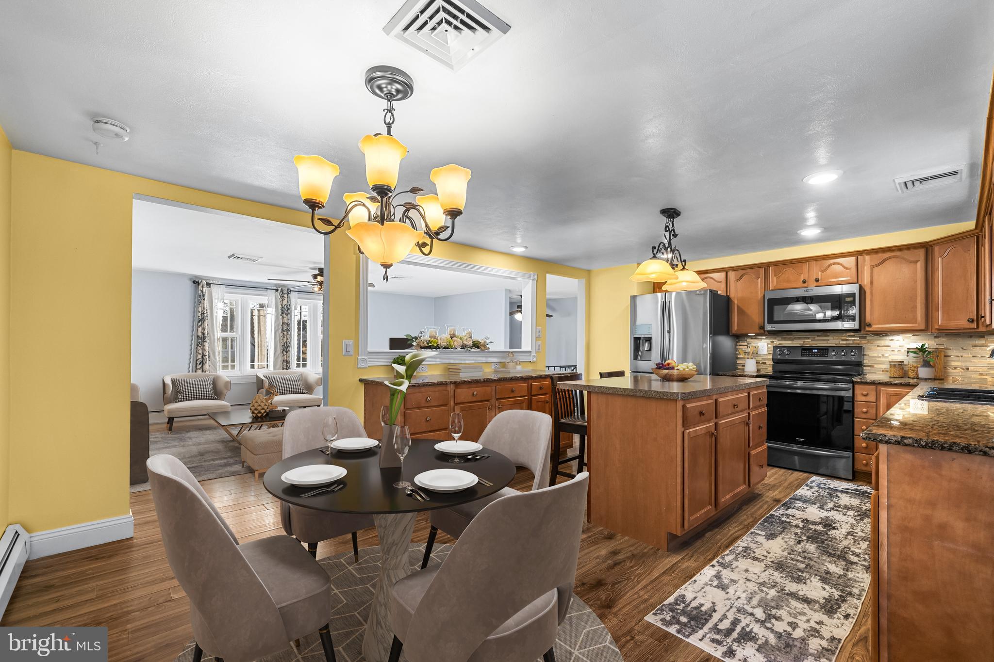 209 Forest Hills Road Red Lion, PA 17356 - Photo 9 of 43 a view of a dining room with furniture a chandelier and wooden floor