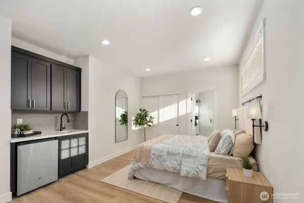 a kitchen with stainless steel appliances granite countertop a sink a microwave and cabinets