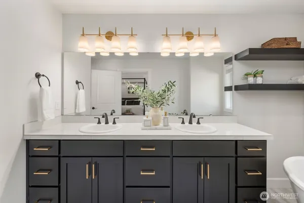 a bedroom with a bed and cabinets