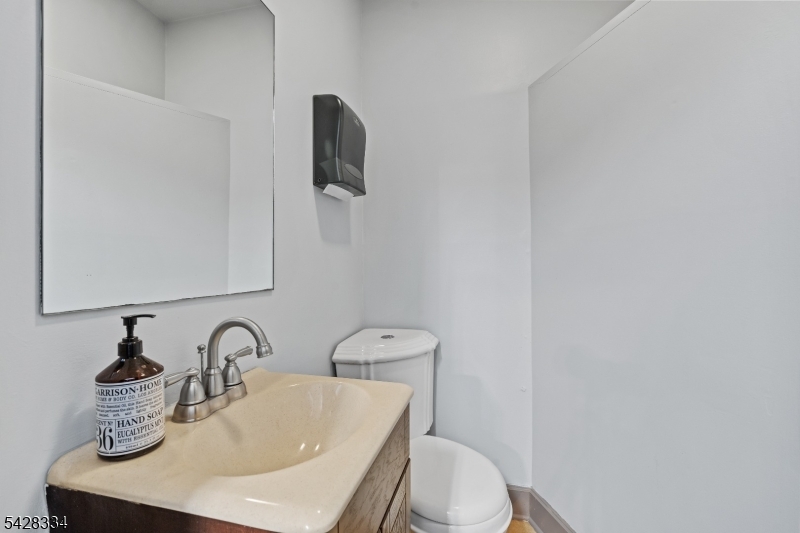 271 Quakertown Road, Unit 2 Pittstown, NJ 08867 - Photo 12 of 25 a bathroom with a toilet sink and mirror
