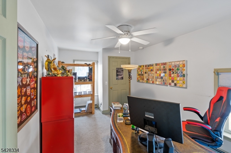 271 Quakertown Road, Unit 2 Pittstown, NJ 08867 - Photo 22 of 25 a view of a livingroom with furniture and a flat screen tv