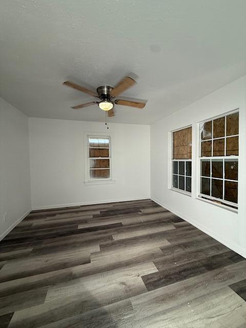 2024 37th Street Lubbock, TX 79412 - Photo 5 of 8 a view of a livingroom with wooden floor and a ceiling fan