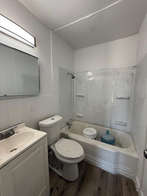 2024 37th Street Lubbock, TX 79412 - Photo 6 of 8 a bathroom with a toilet a sink and mirror