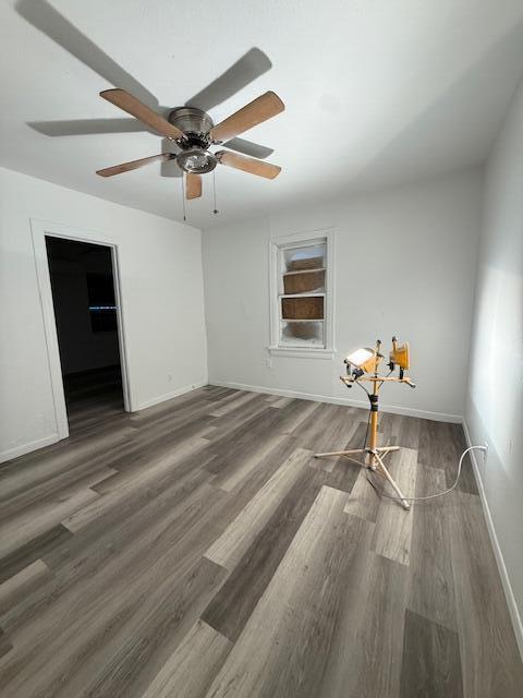 2024 37th Street Lubbock, TX 79412 - Photo 7 of 8 a bedroom with a bed and a ceiling fan