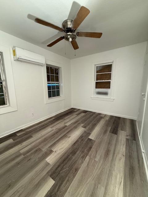2024 37th Street Lubbock, TX 79412 - Photo 8 of 8 a view of a livingroom with a ceiling fan and wooden floor