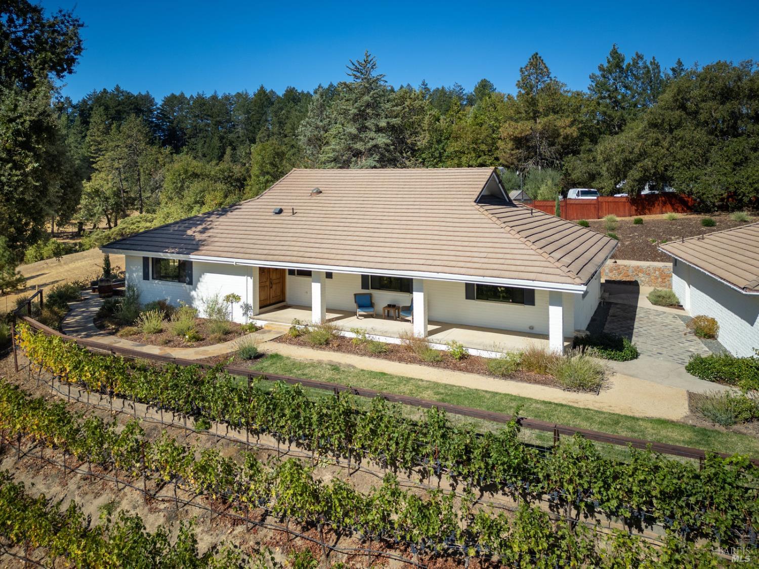 875 White Cottage Road North Angwin, CA 94508 - Photo 13 of 59 a front view of a house with garden