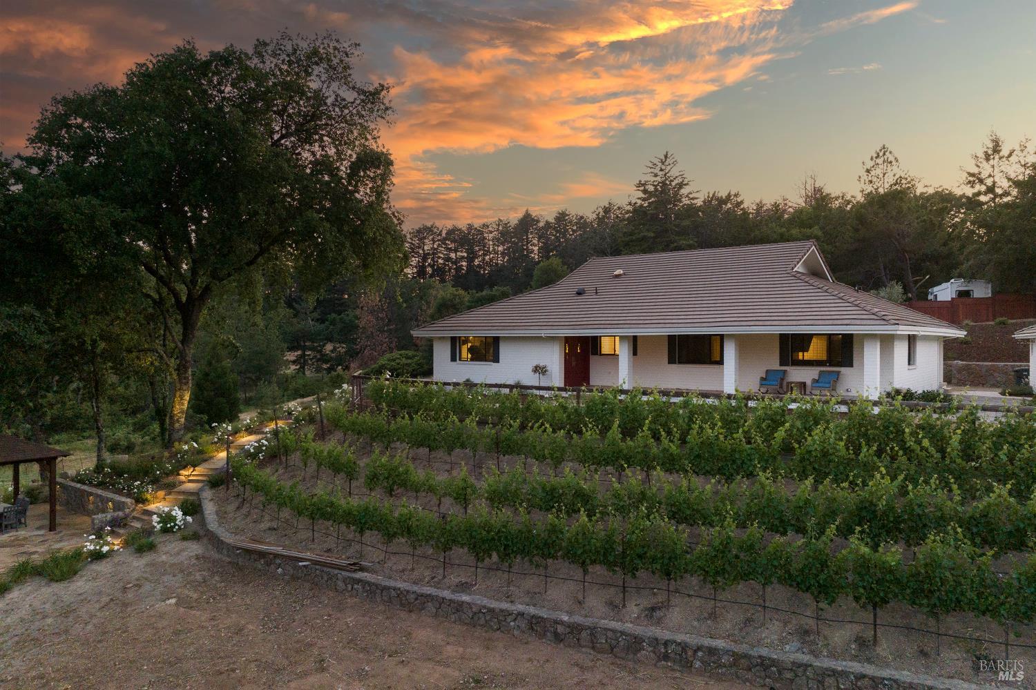 875 White Cottage Road North Angwin, CA 94508 - Photo 2 of 59 a front view of a house with a garden