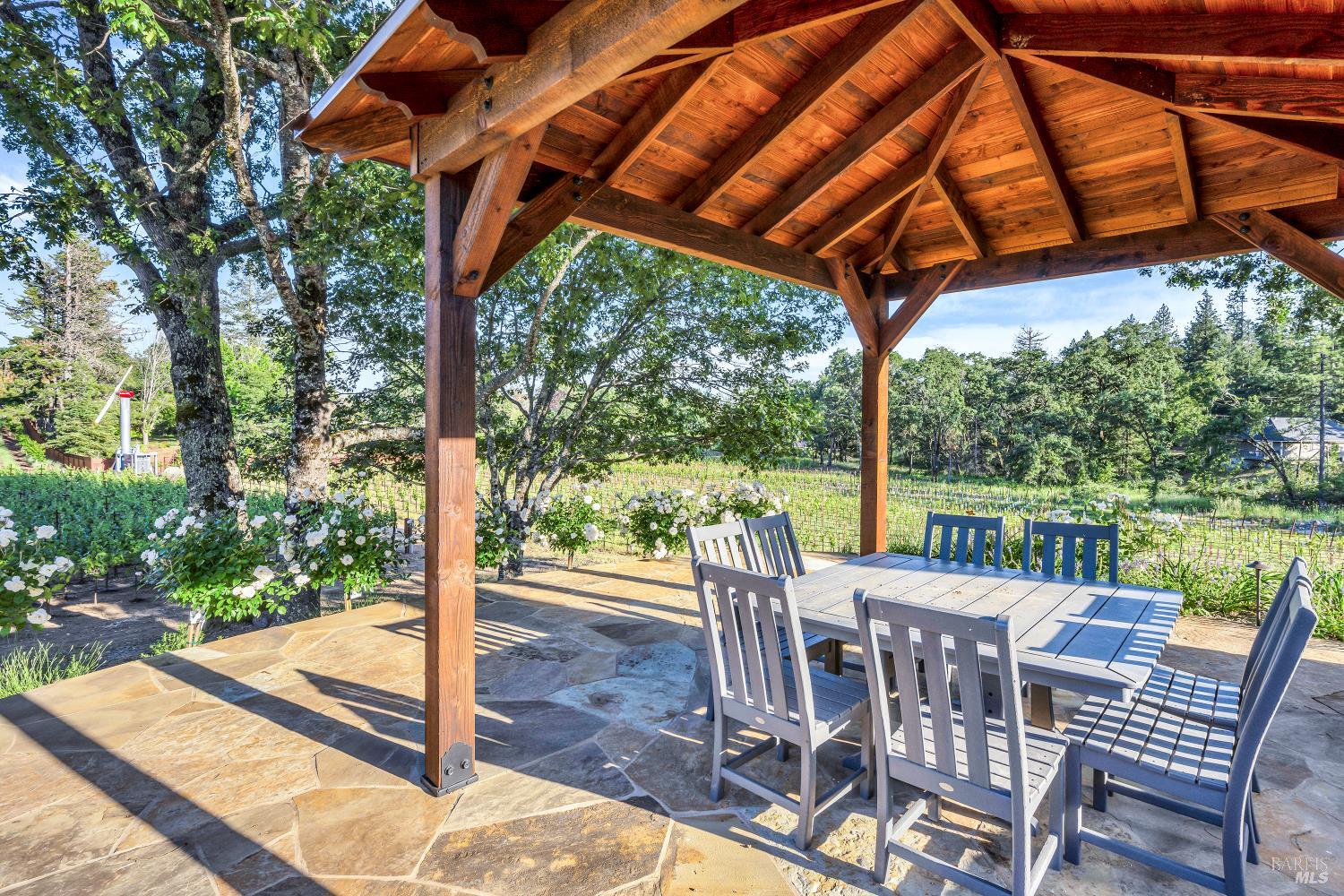 875 White Cottage Road North Angwin, CA 94508 - Photo 24 of 59 a view of a patio with a table chairs and a backyard