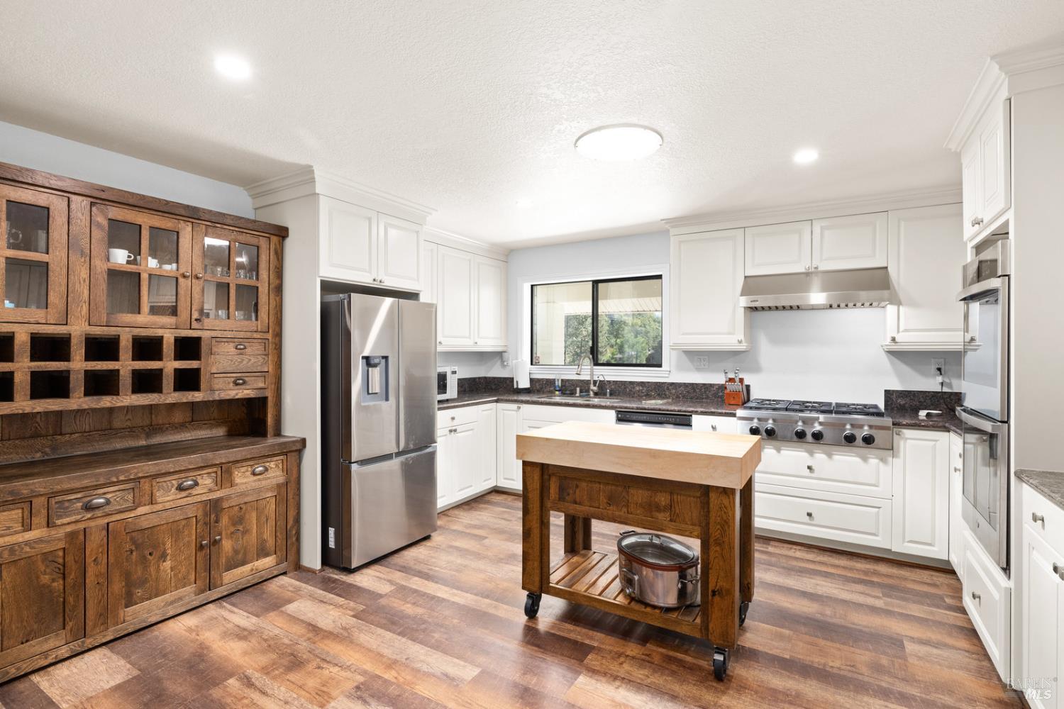 875 White Cottage Road North Angwin, CA 94508 - Photo 35 of 59 a kitchen with a stove a refrigerator and a stove top oven