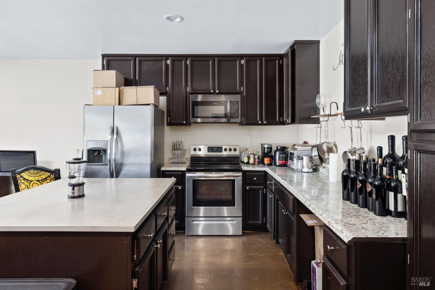 875 White Cottage Road North Angwin, CA 94508 - Photo 50 of 59 a kitchen with stainless steel appliances a sink stove and refrigerator