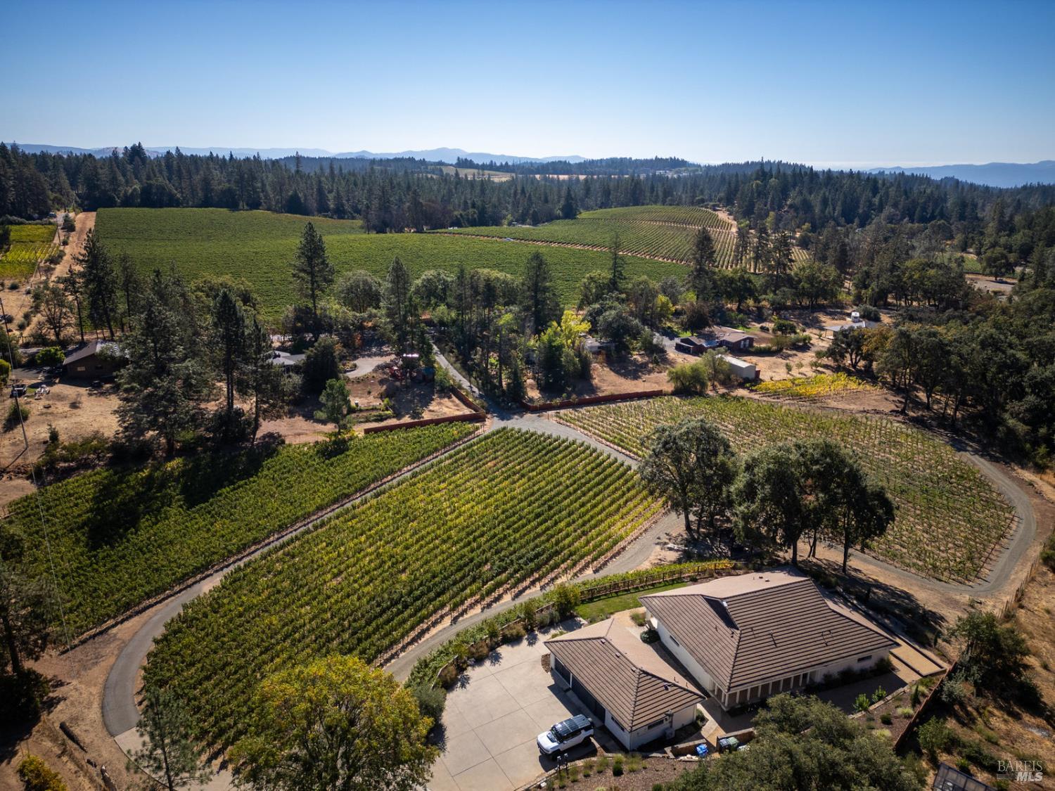 875 White Cottage Road North Angwin, CA 94508 - Photo 5 of 59 an aerial view of a house with a lake view