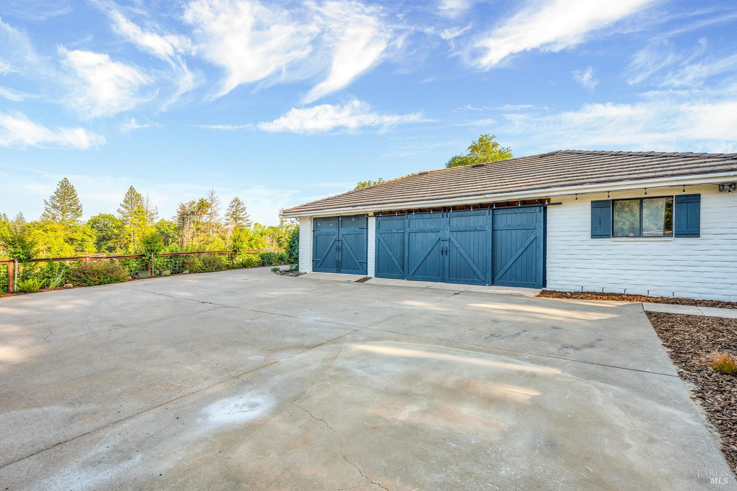 875 White Cottage Road North Angwin, CA 94508 - Photo 52 of 59 a front view of a house with a yard and garage