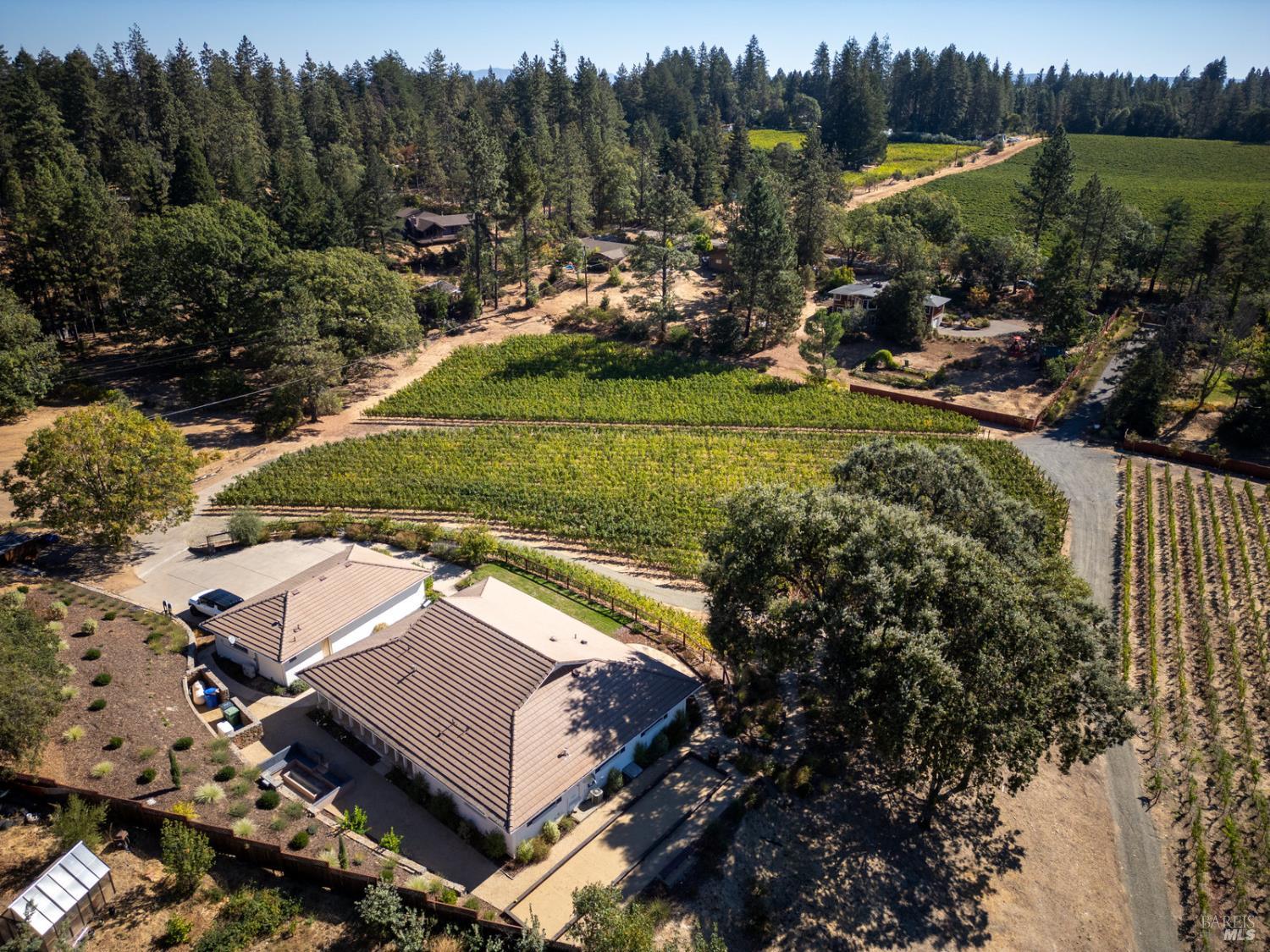 875 White Cottage Road North Angwin, CA 94508 - Photo 53 of 59 an aerial view of a house with a garden and lake view