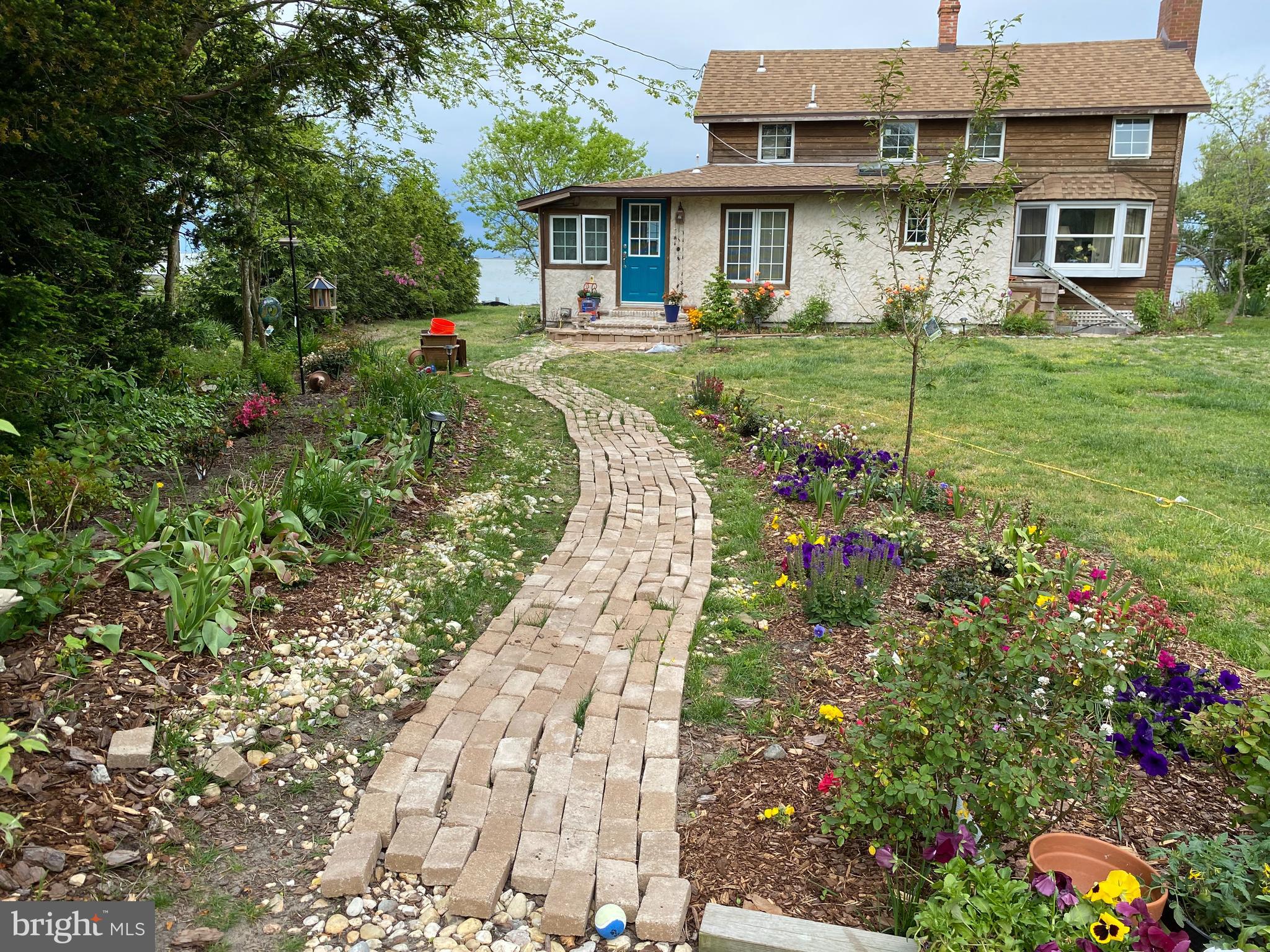 20800 Bivalve Wharf Road Bivalve, MD 21865 - Photo 1 of 31 a front view of a house with a yard and fountain