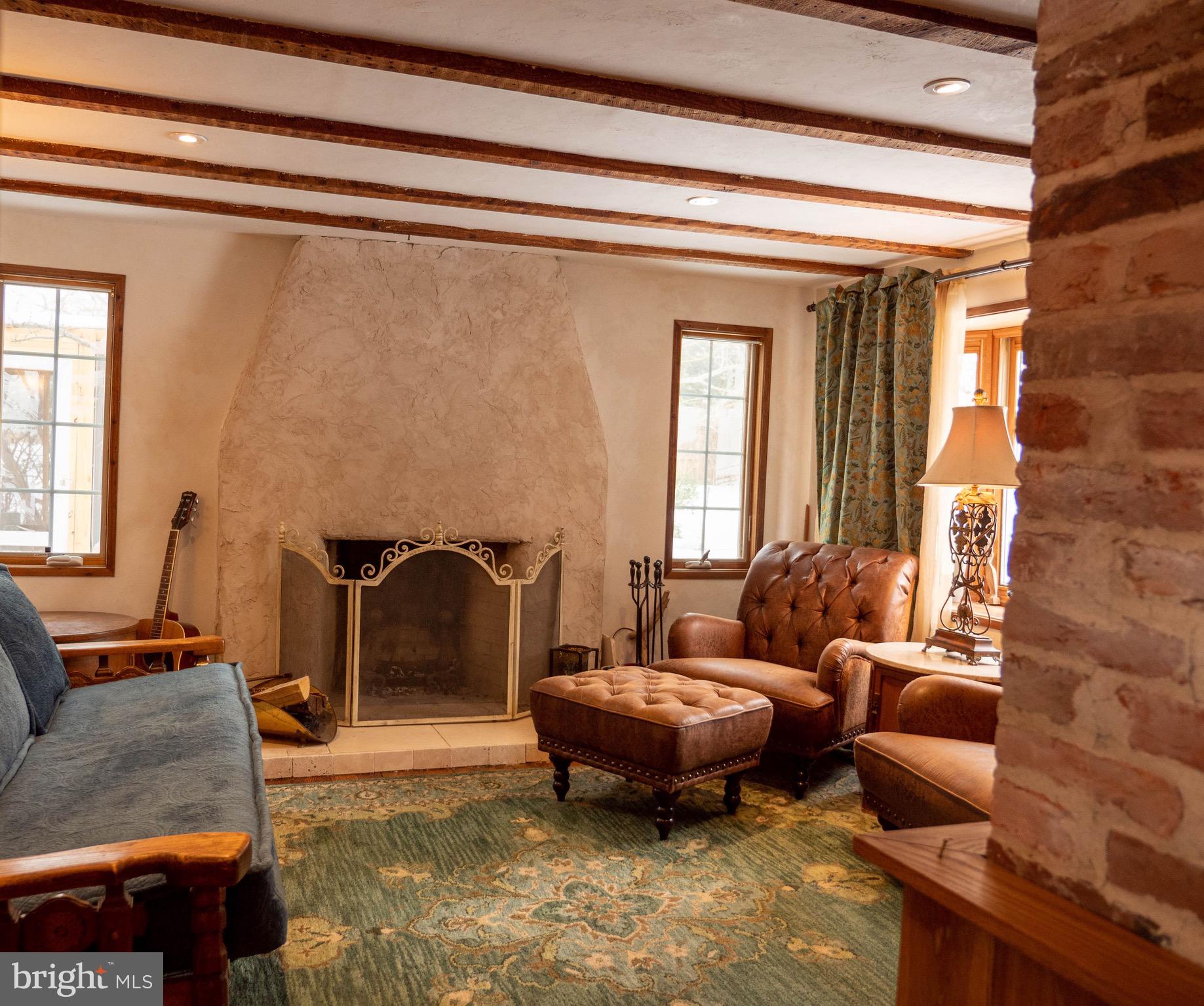 20800 Bivalve Wharf Road Bivalve, MD 21865 - Photo 11 of 31 a living room with furniture and a fireplace