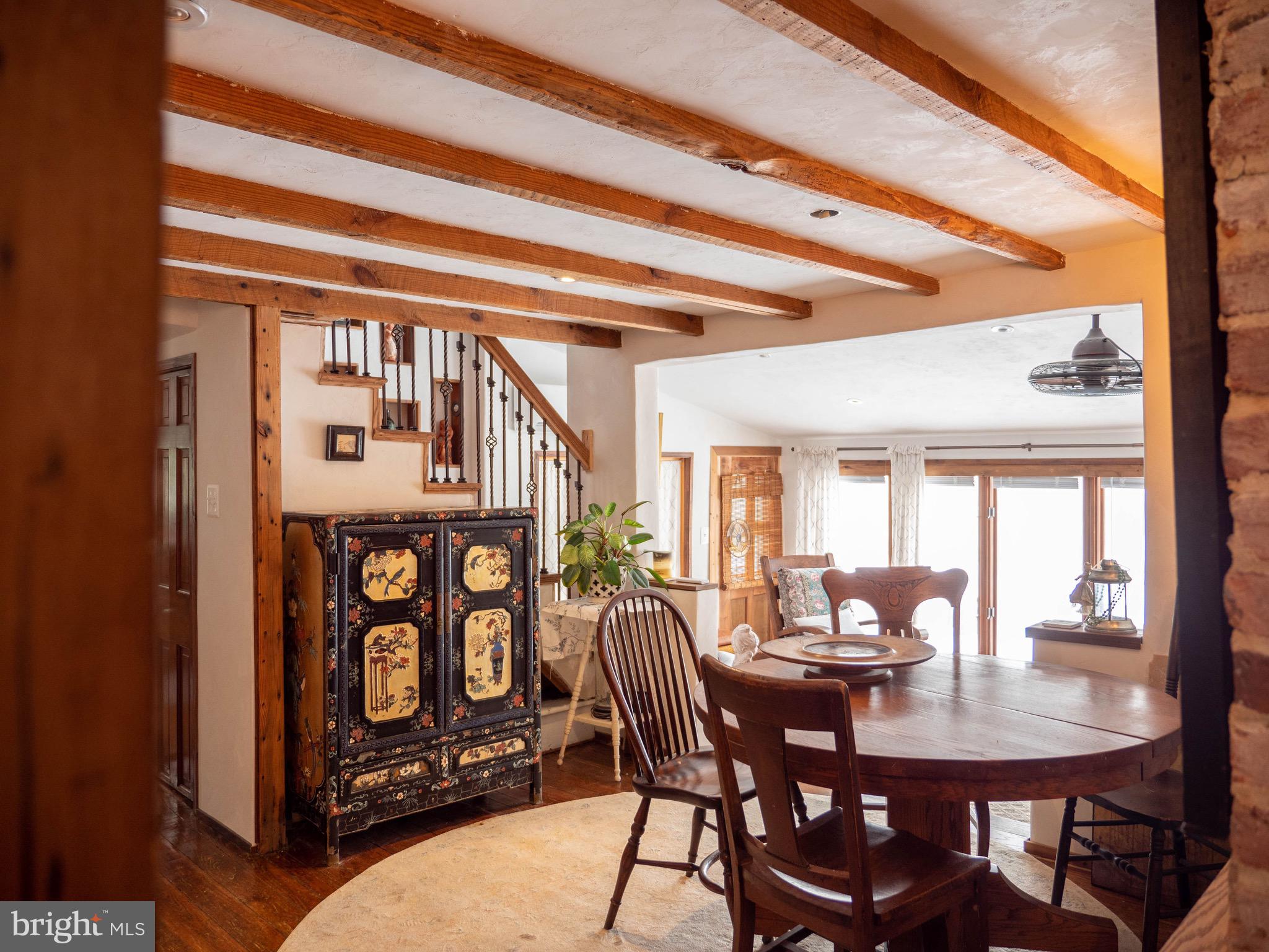 20800 Bivalve Wharf Road Bivalve, MD 21865 - Photo 14 of 31 a view of a a dining room with furniture window and wooden floor