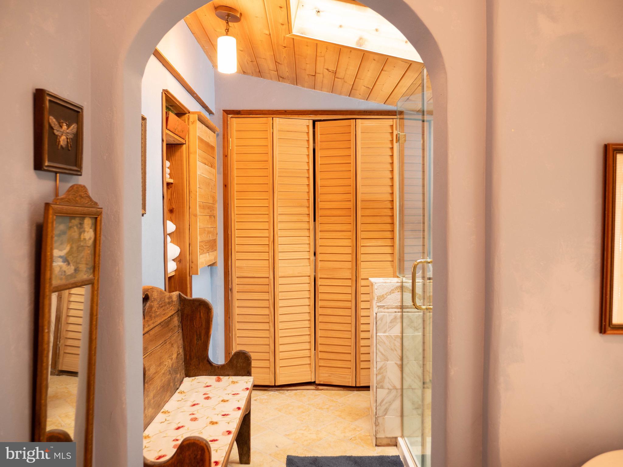 20800 Bivalve Wharf Road Bivalve, MD 21865 - Photo 16 of 31 a bedroom with a bed and wooden floor