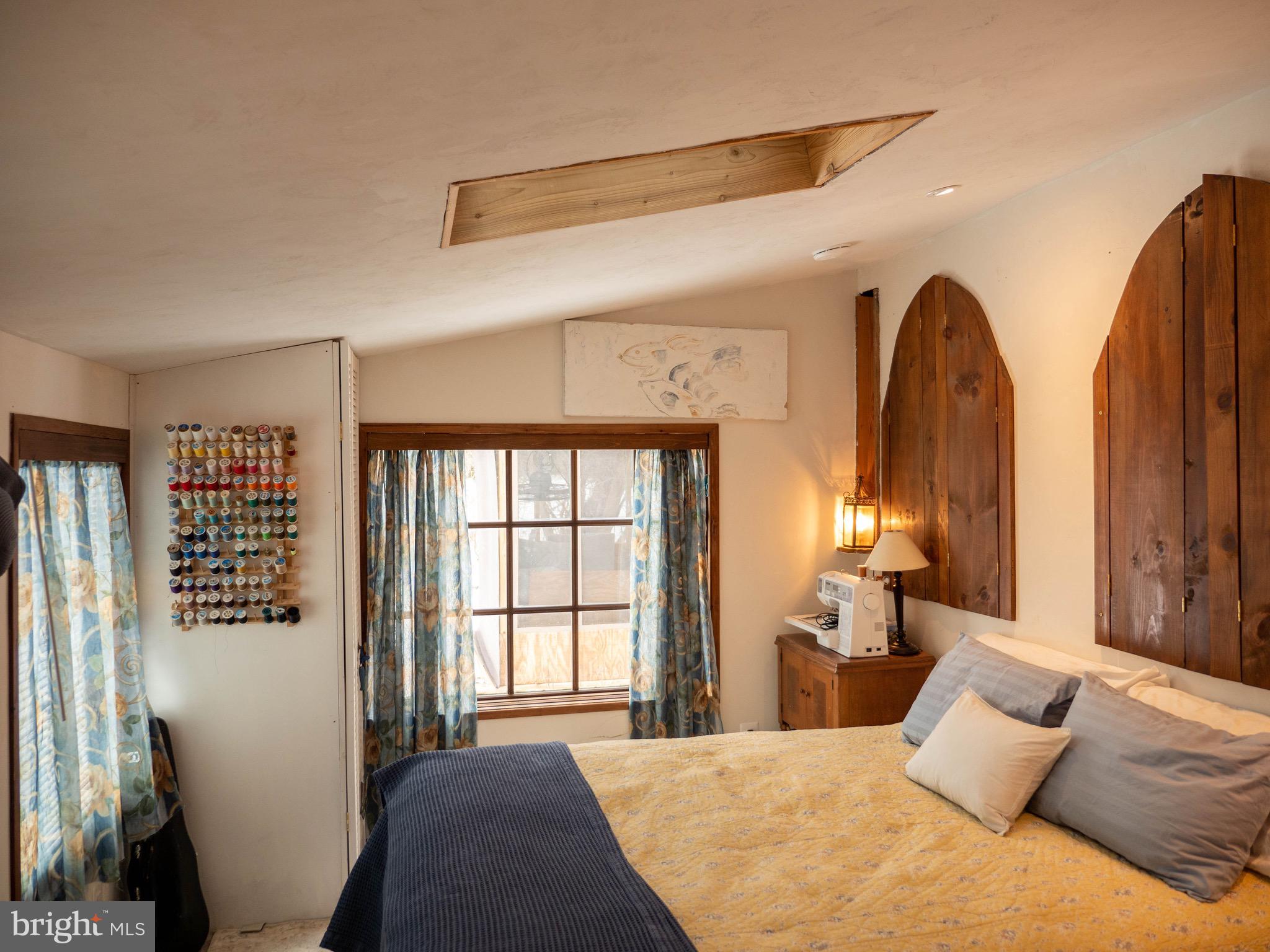 20800 Bivalve Wharf Road Bivalve, MD 21865 - Photo 19 of 31 a bedroom with a large bed and a window