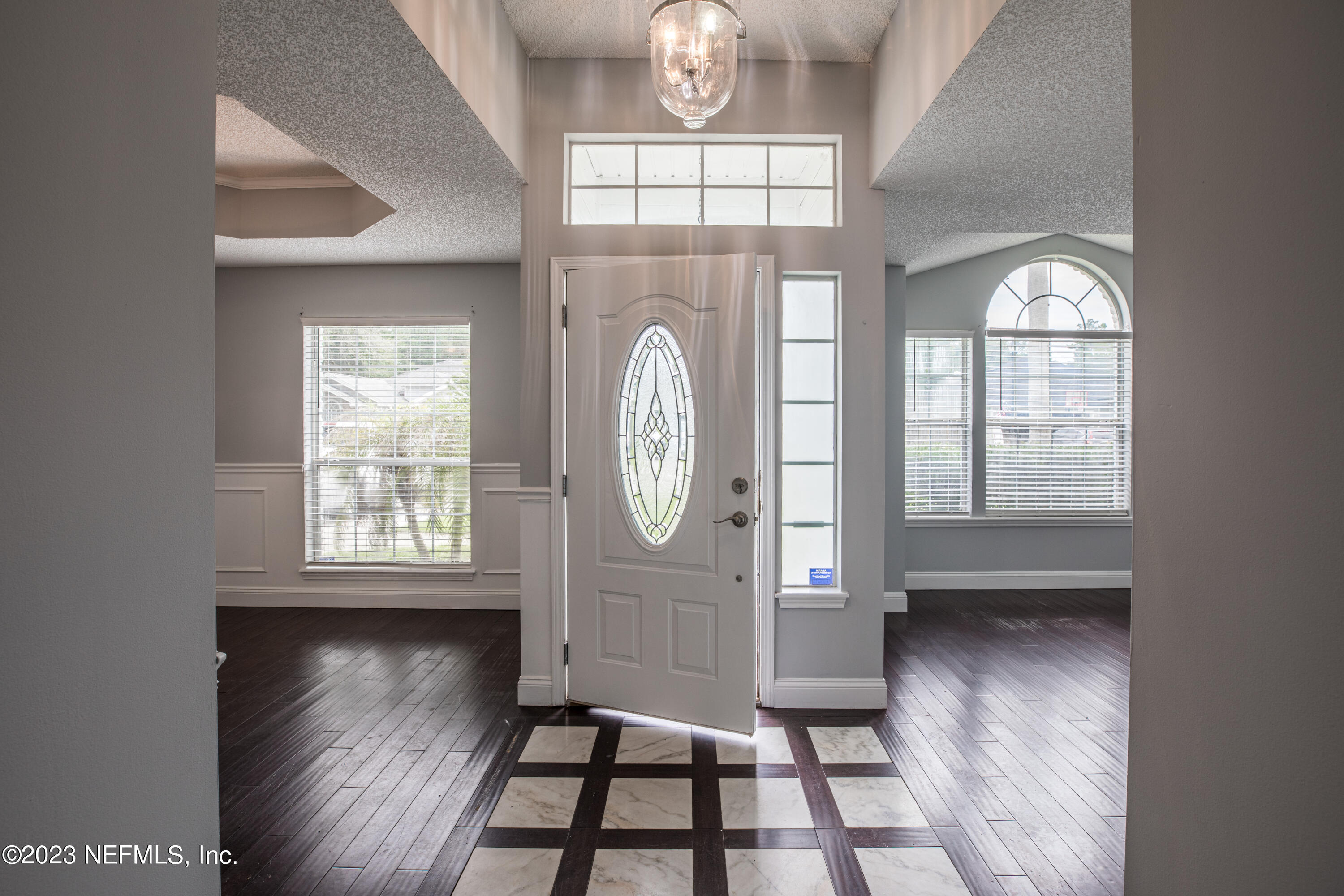 13607 Capistrano Drive South Jacksonville, FL 32224 - Photo 3 of 24 a view of an entryway with wooden floor