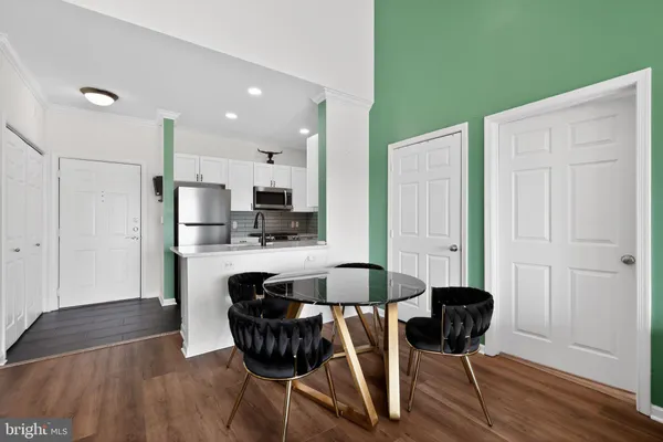 a living room with lots of furniture and a chandelier