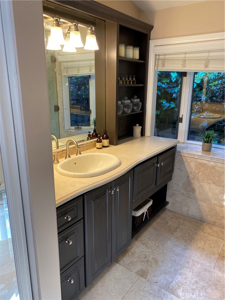 821 Emerald Bay Laguna Beach, CA 92651 - Photo 14 of 15 a bathroom with a sink and a mirror