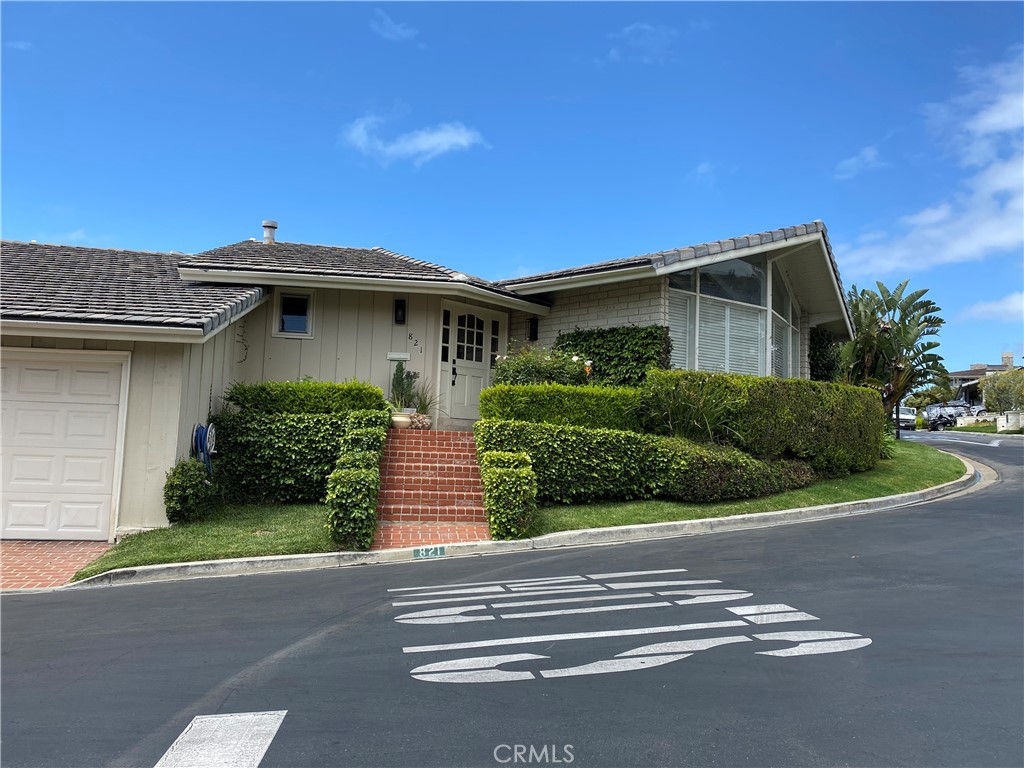 821 Emerald Bay Laguna Beach, CA 92651 - Photo 15 of 15 a front view of a house with a yard