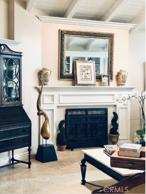 821 Emerald Bay Laguna Beach, CA 92651 - Photo 5 of 15 a living room with furniture a fireplace and a potted plant