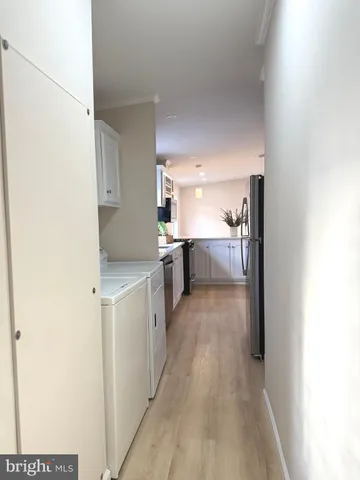 a kitchen with a refrigerator and a sink