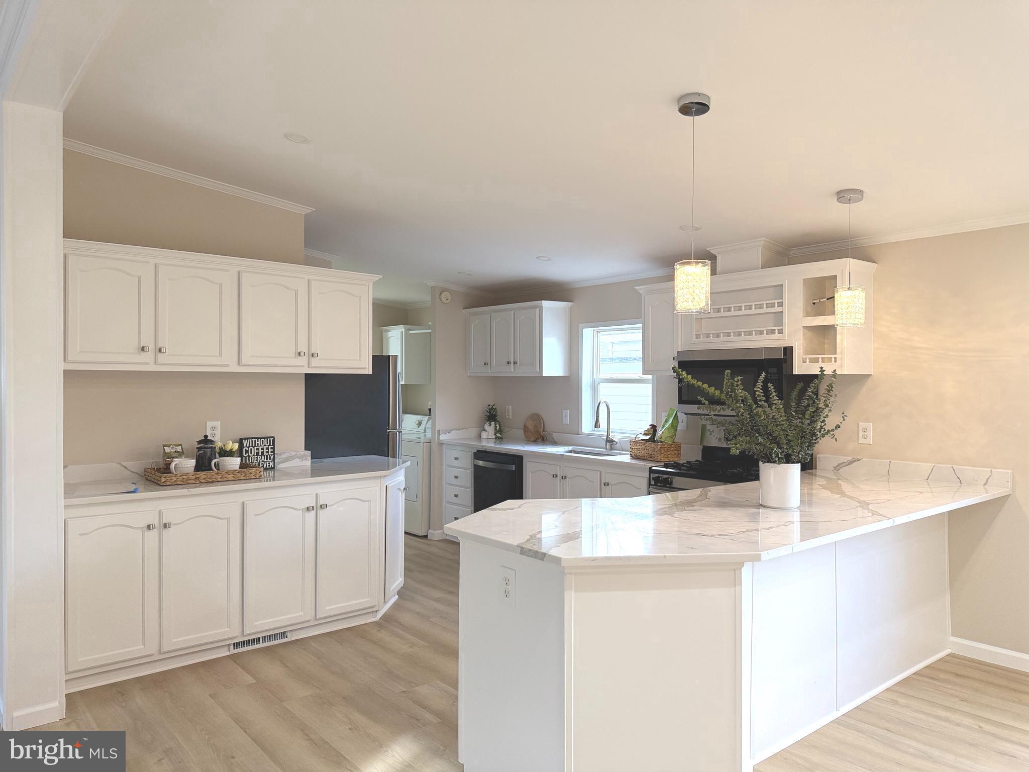 14517 Braniff Circle Chantilly, VA 20151 - Photo 3 of 25 a kitchen with cabinets a sink and appliances