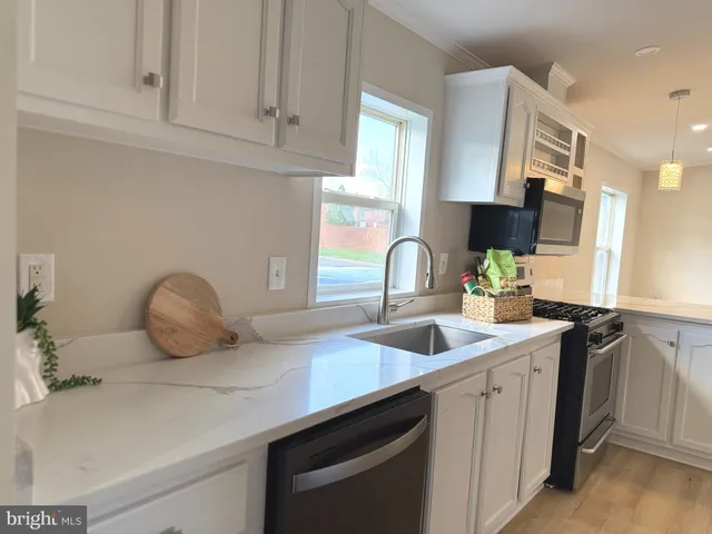a kitchen with a sink and cabinets