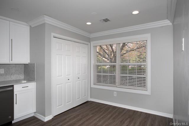 69 Overlook Drive, Unit 69 Farmingville, NY 11738 - Photo 4 of 16 a view of an empty room with wooden floor and a window